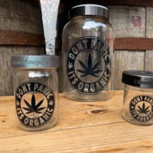 Three glass jars with cannabis leaf logo