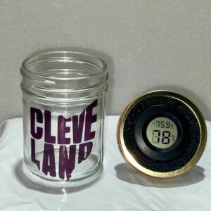 Clear glass jar with 'Cleveland' text and a digital thermometer lid.
