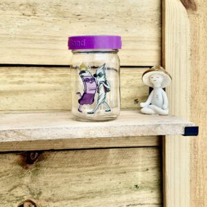 Jar with dancing character stickers and figurine