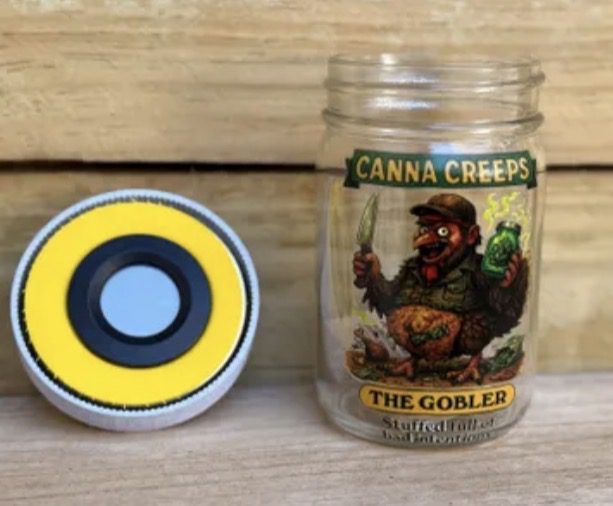 Glass jar with goblin label and yellow lid