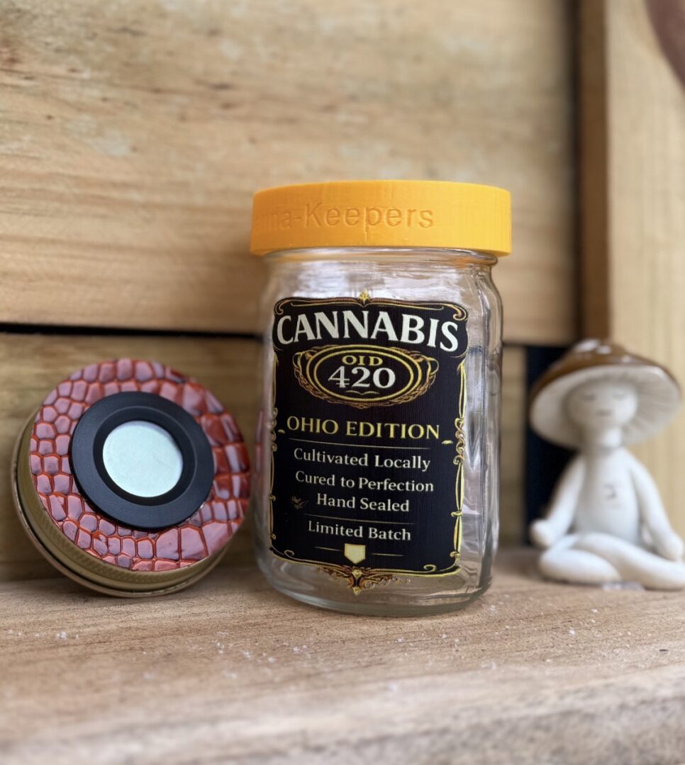 Small glass cannabis jar with yellow lid