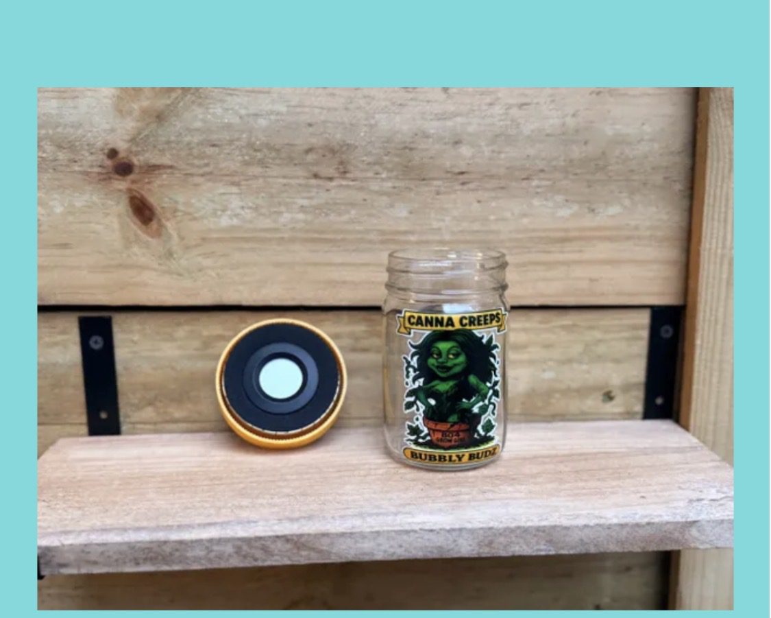 Canna Creeps jar and gold-rimmed lid