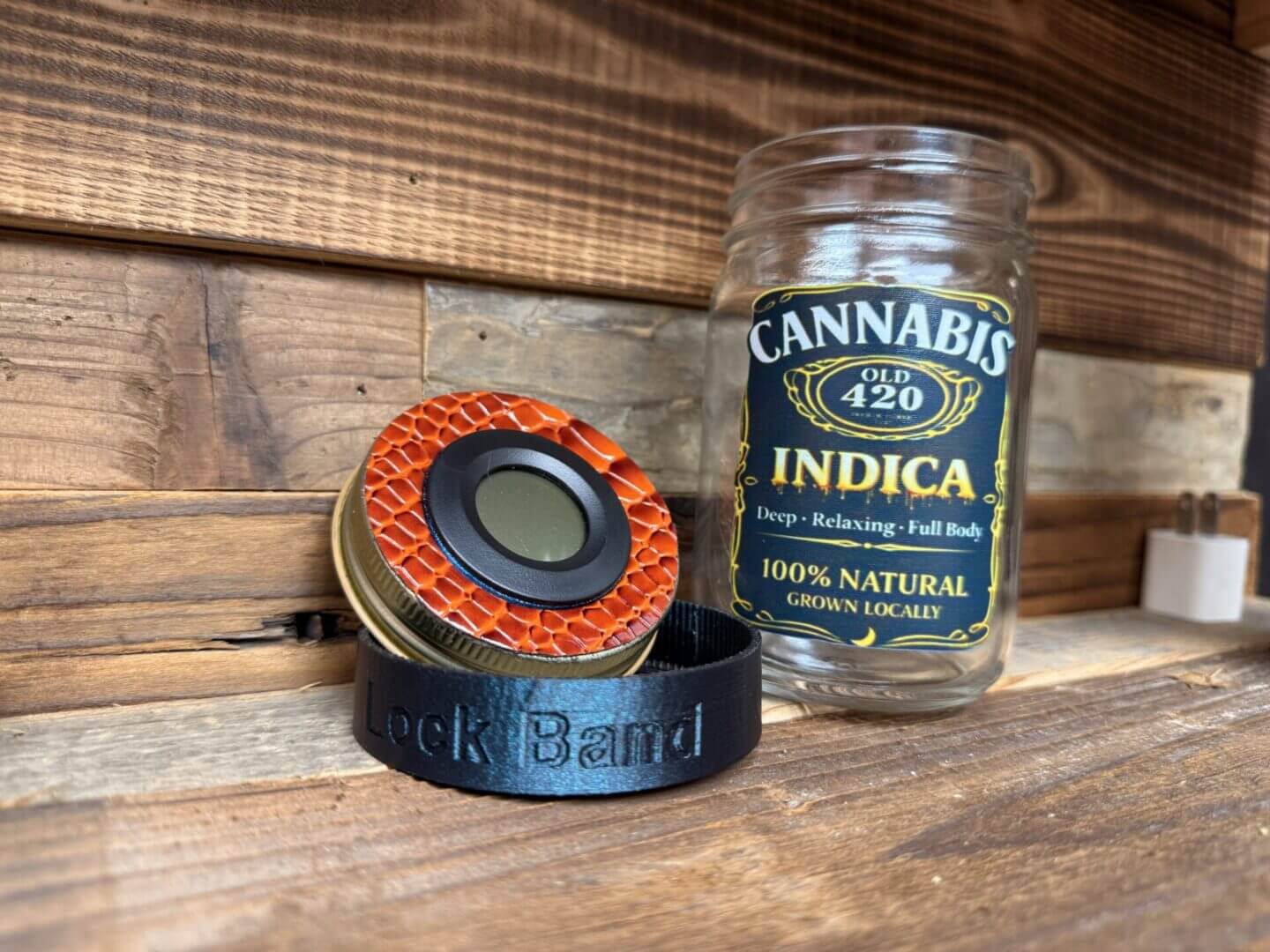 Glass Cannabis Indica jar with grinder and wristband