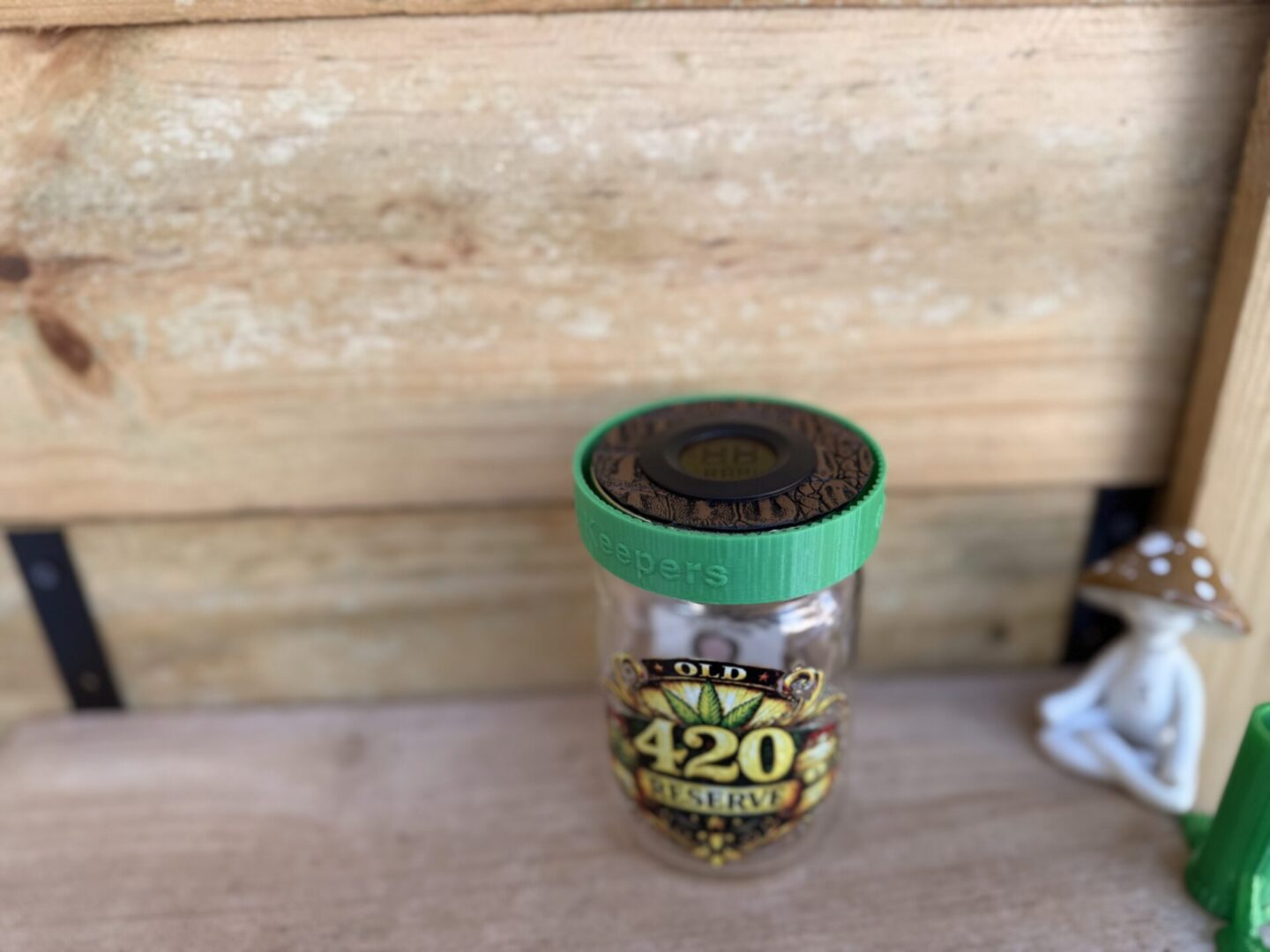 420-labeled glass jar on wooden surface