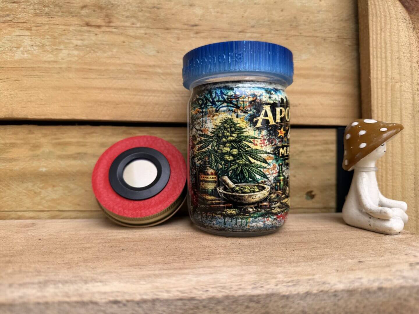 Colorful jar with red grinder and mushroom